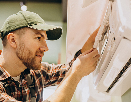 repairman doing air conditioner service